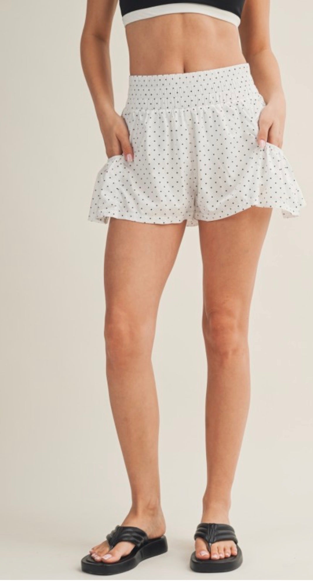 White and black polka dot side flare athletic shorts