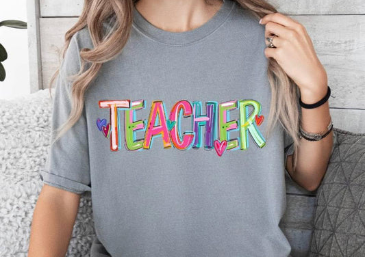Teacher on grey tee or crew