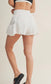 White and black polka dot side flare athletic shorts