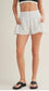 White and black polka dot side flare athletic shorts