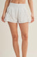 White and black polka dot side flare athletic shorts